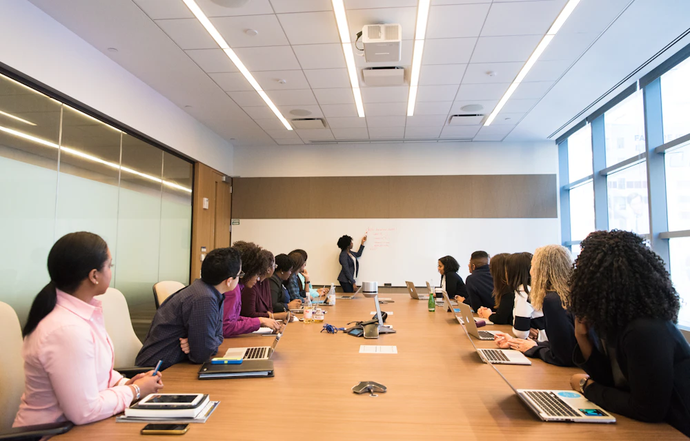 Illustrative photo of an agency-style team meeting in a bright office